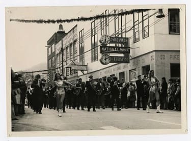 historic photo of the UPIKE band during a downtown parade