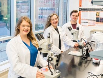 Students in the lab working on research.