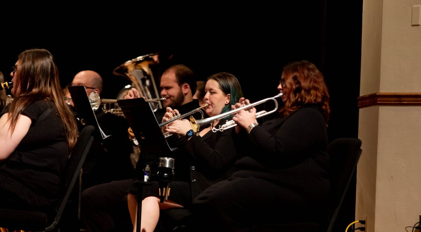 concert band ensemble performs on campus