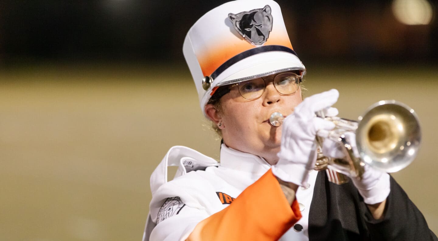 marching band student Amy Smallwood performs at halftime