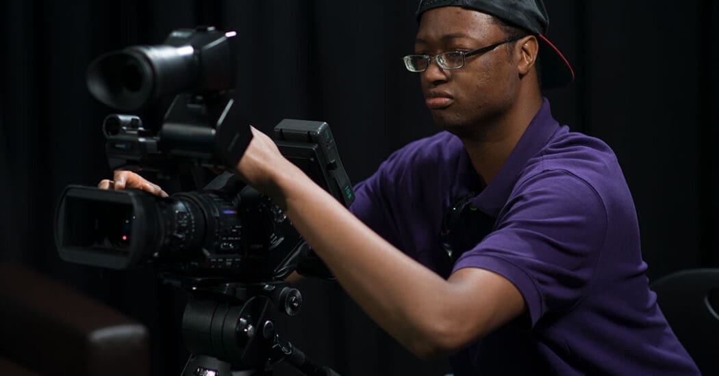 Student working behind the camera.