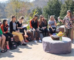 Class meeting outside at the president's firepit.