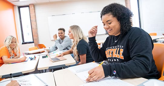 Students studying in a classroom.