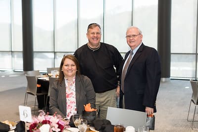 UPIKE staff Mary Moore and Ron Damron with guest