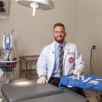 KYCO Student Jeremy Penn Headshot in optometric surgery room on campus.