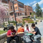 Students studying on Benefactors Plaza.