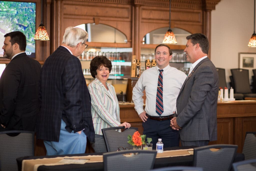 Dr. Webb speaking with guests