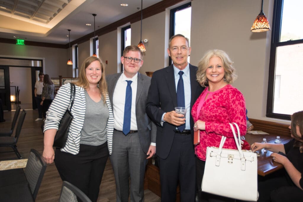 group of guests pose for a photo
