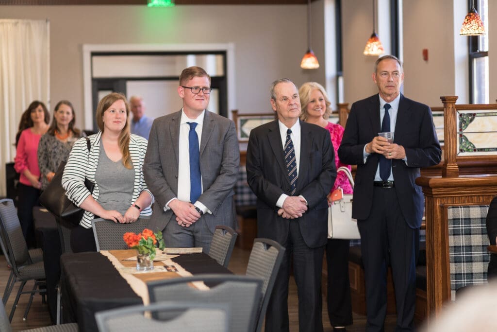 guests listening to speaker