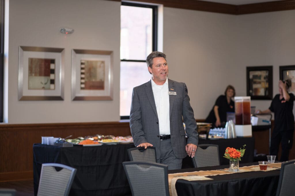Dr. Webb speaking to guests