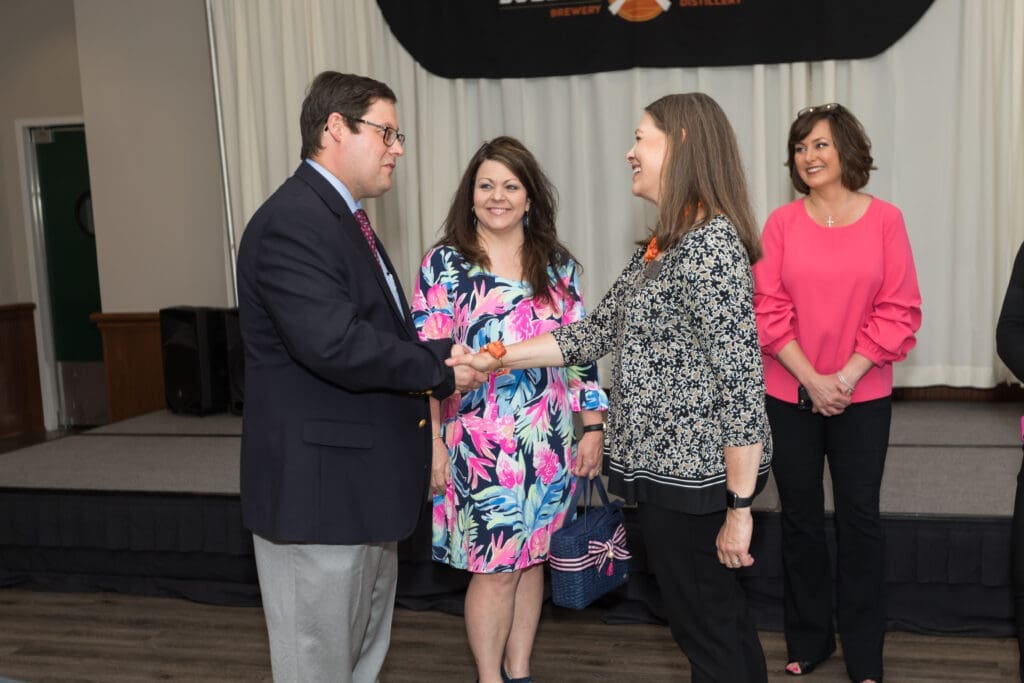 First Lady Kay Webb shaking hands with a guest