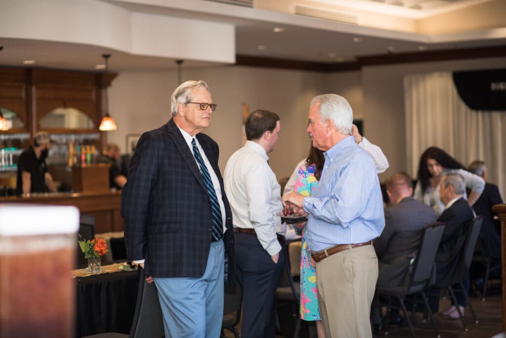 Judge Eddy Coleman speaking with a guest
