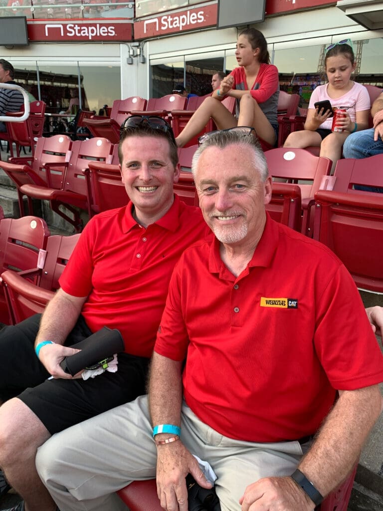 Alumni watching baseball game