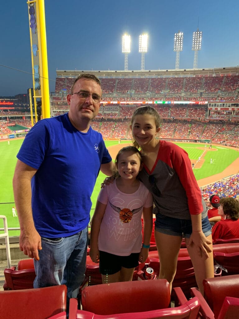 Family enjoying Reds game