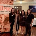 Alumni gathered at UPIKE even signage