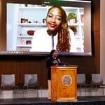 KYCOM Student Adaku Ikoh introducing keynote speaker