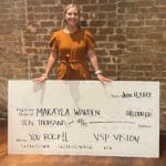 KYCO Student Makayla Warden holding check