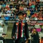 Ivan Perez crosses the stage at commencement