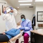 Dental students with patient